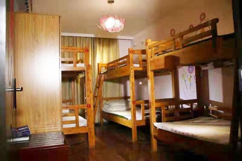 Postel nebo postele na pokoji v ubytování Xi'an The Facebook Youth Hostel
