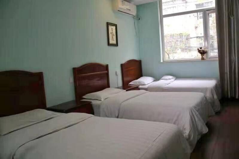 Postel nebo postele na pokoji v ubytování Xi'an The Facebook Youth Hostel
