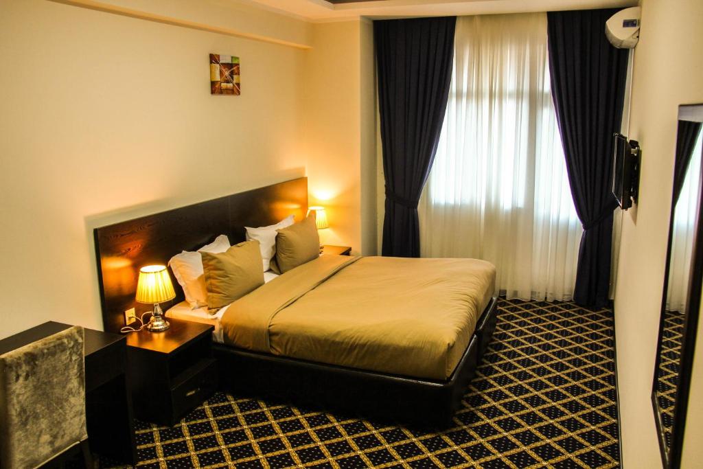 
Кровать или кровати в номере Kristal Hotel
