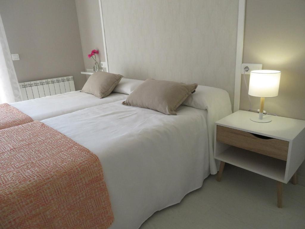 Postel nebo postele na pokoji v ubytování Alcañiz Flats I