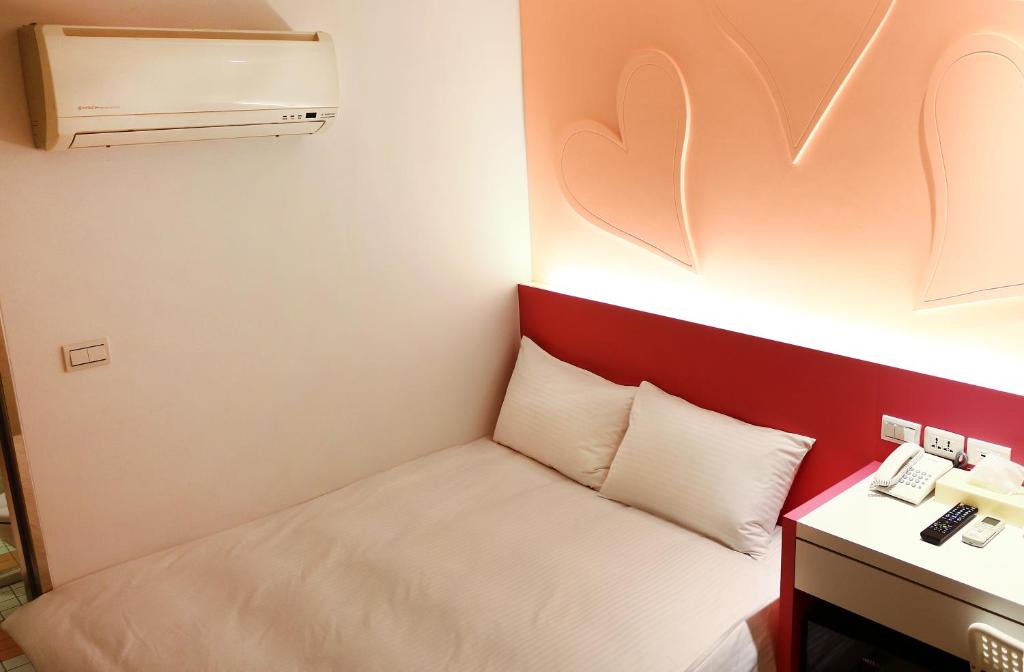 Postel nebo postele na pokoji v ubytování Haozhan Hotel