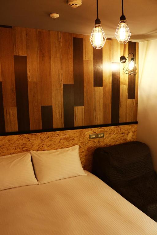 Postel nebo postele na pokoji v ubytování Haozhan Hotel
