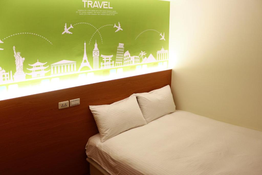Postel nebo postele na pokoji v ubytování Haozhan Hotel