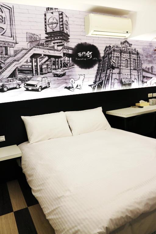 Postel nebo postele na pokoji v ubytování Haozhan Hotel