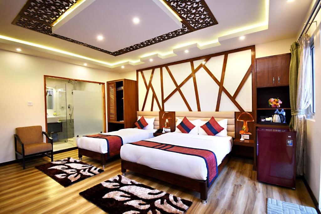 Postel nebo postele na pokoji v ubytování Hotel Jampa