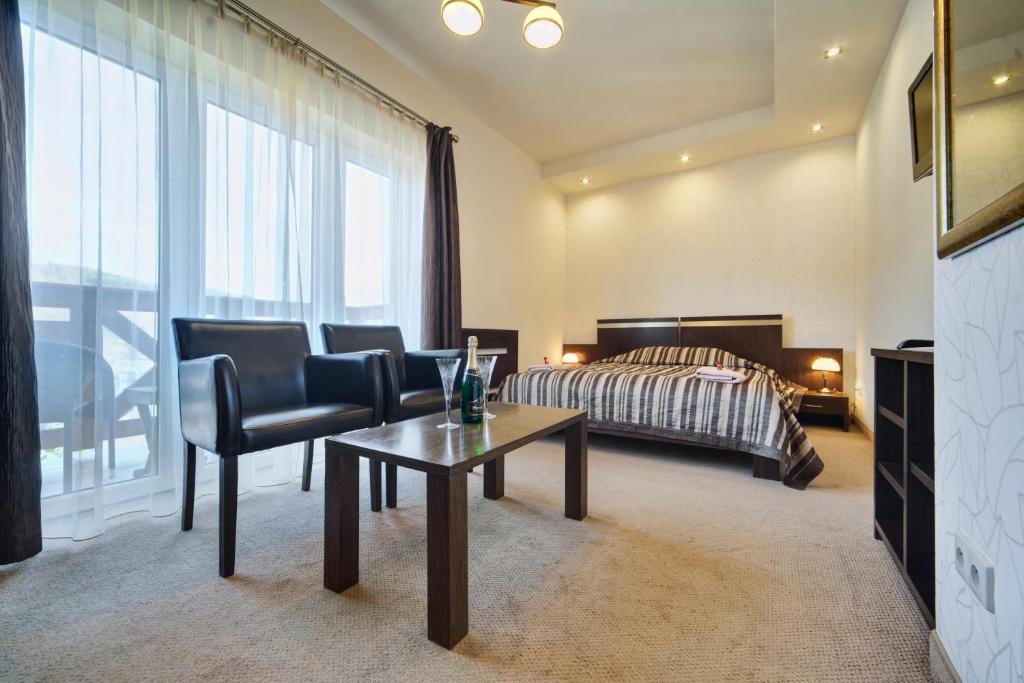 Posteľ alebo postele v izbe v ubytovaní Hotel Orlik