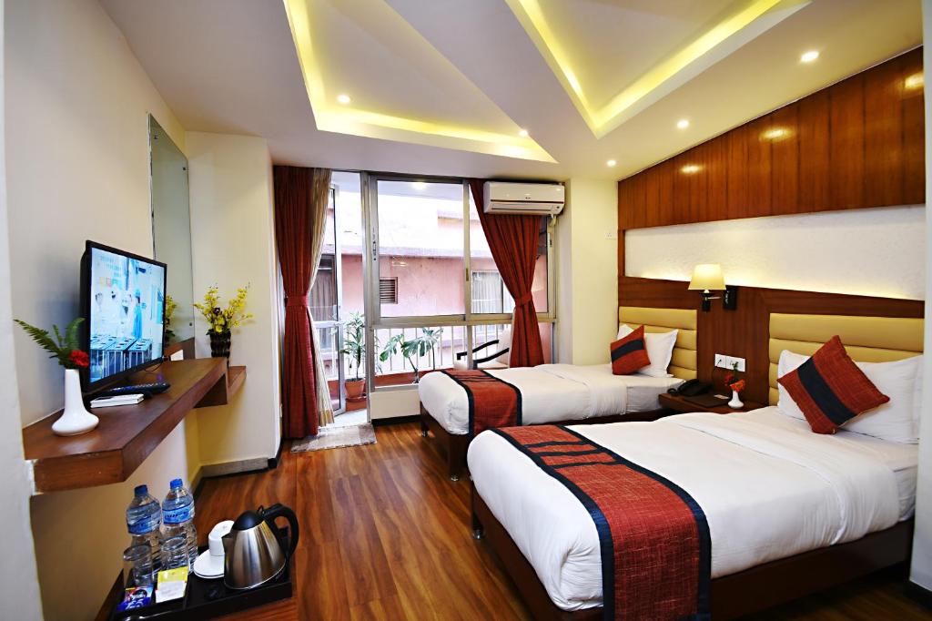 Postel nebo postele na pokoji v ubytování Hotel Jampa