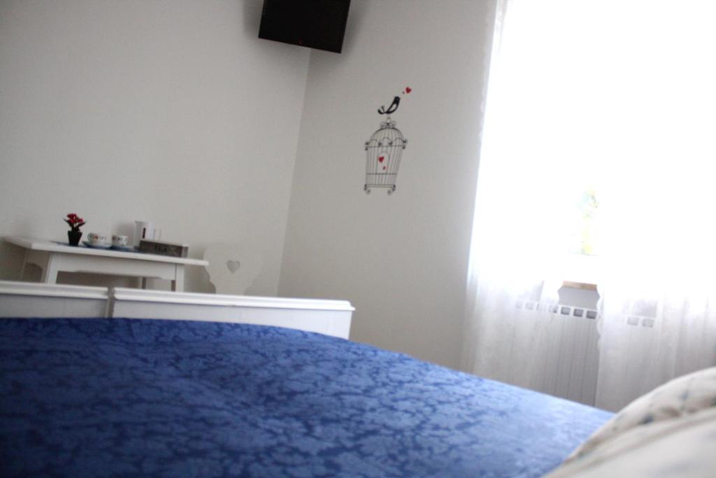 Łóżko lub łóżka w pokoju w obiekcie Corte del Garda Home