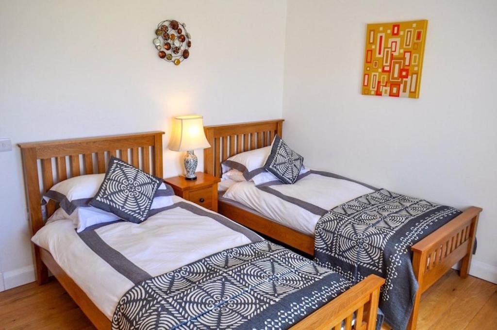 Postel nebo postele na pokoji v ubytování Lurach House