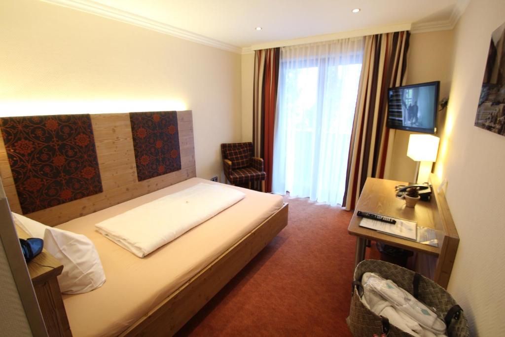 Postel nebo postele na pokoji v ubytování Hotel Seeblick