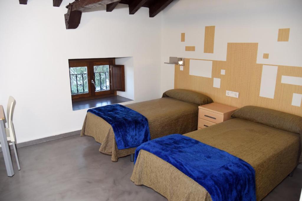 Postel nebo postele na pokoji v ubytování Albergue Inturjoven Cazorla