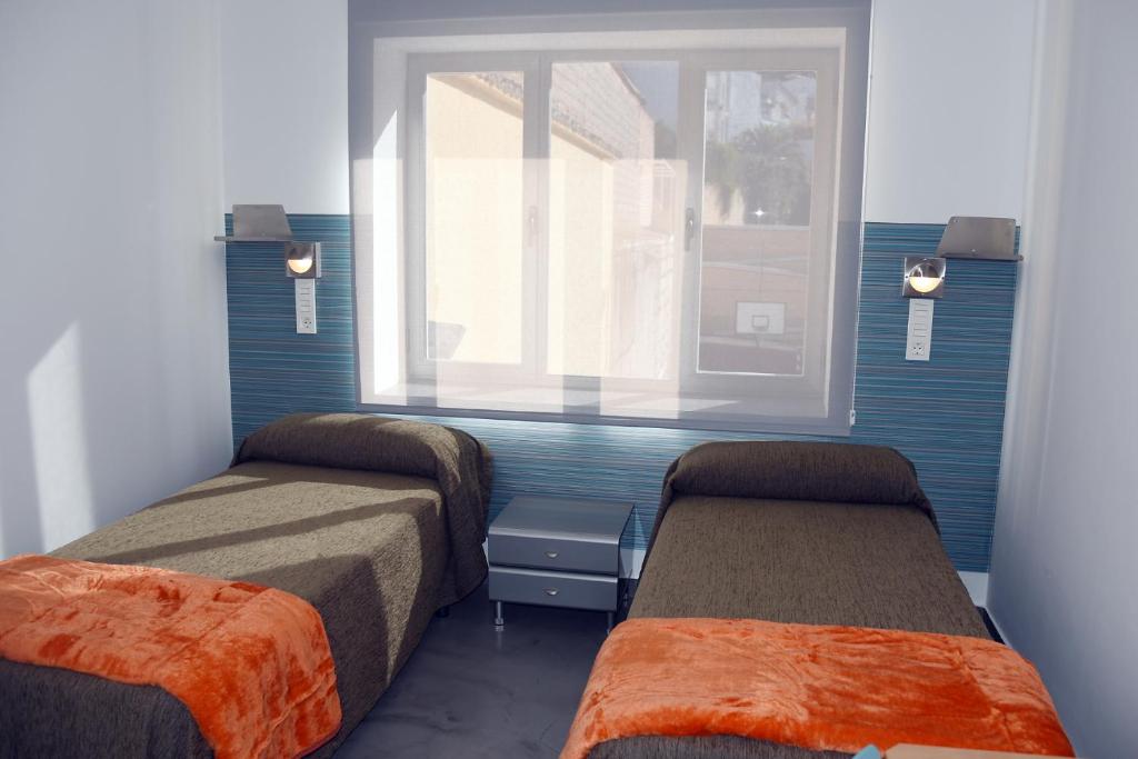 Postel nebo postele na pokoji v ubytování Albergue Inturjoven Cazorla