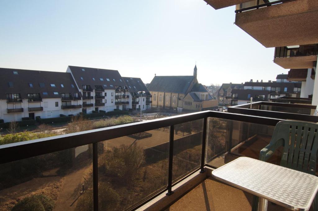 a balcony with a view of a city at Residentie Koksijde promenade in Koksijde