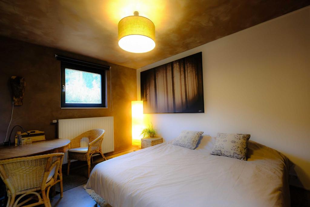 Postel nebo postele na pokoji v ubytování Maison d'Hôtes Cerf'titude