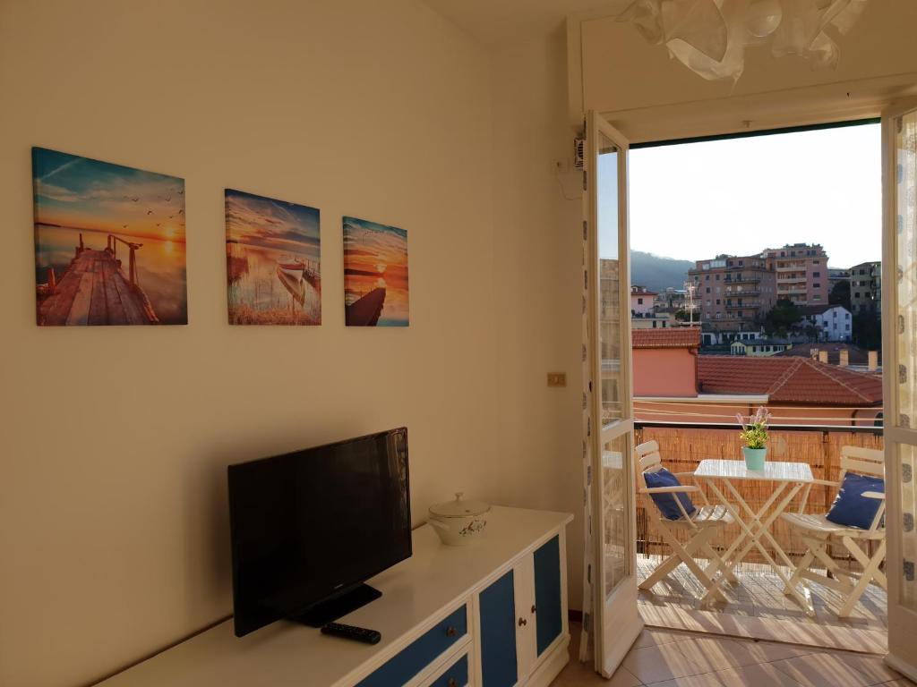 a living room with a flat screen tv on a wall at Appartamento Maestrale in Rapallo