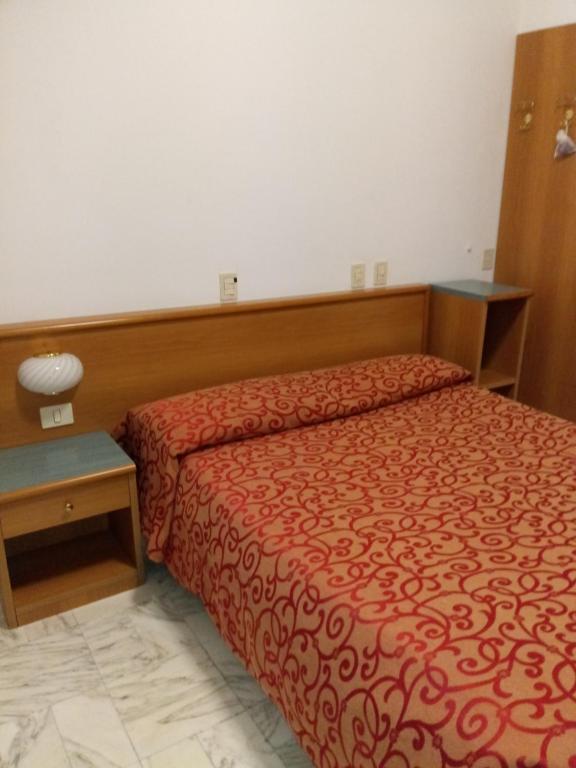 Postel nebo postele na pokoji v ubytování Hotel Valentino