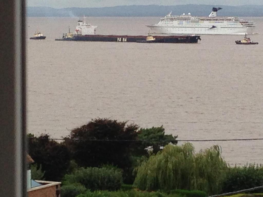 a large ship in the water with a cruise ship at The Nook @ Drop Anchor in Portishead