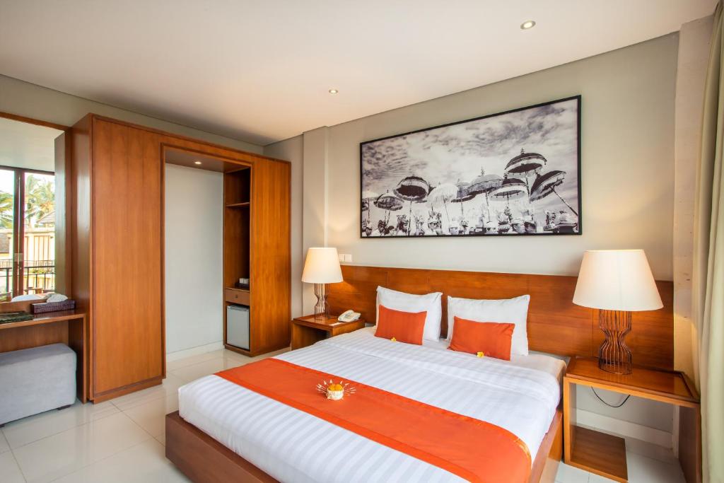 Postel nebo postele na pokoji v ubytování Bakung Ubud Resort and Villa