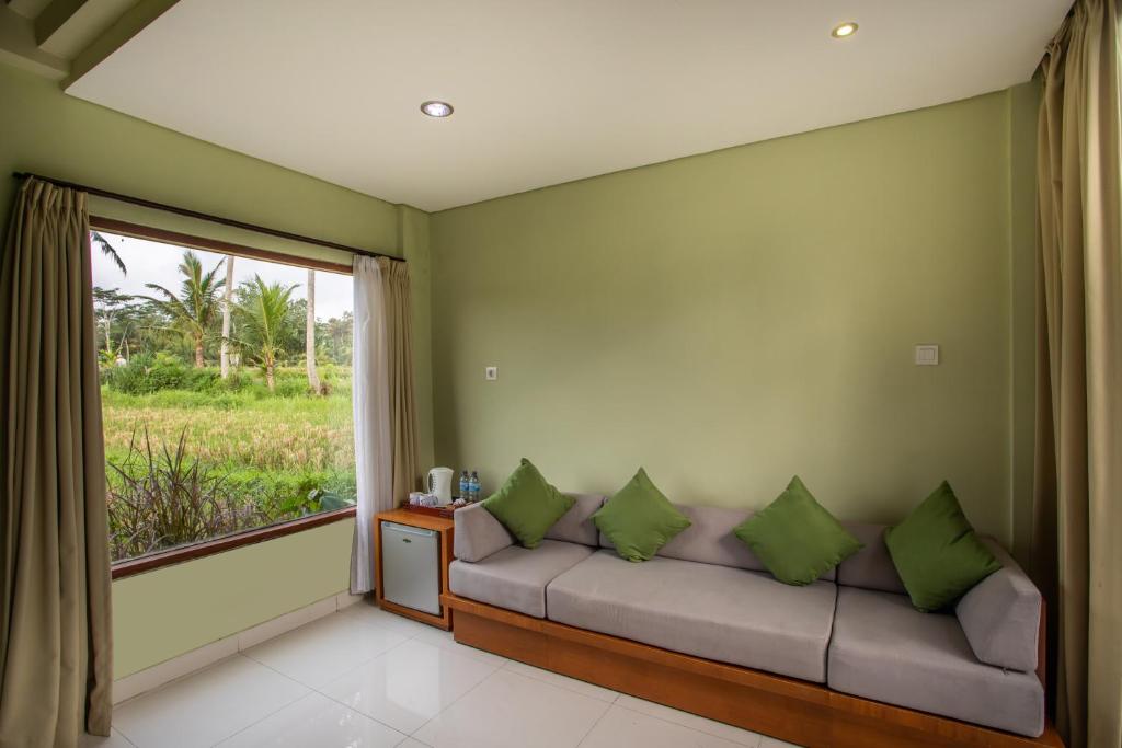 Posezení v ubytování Bakung Ubud Resort and Villa
