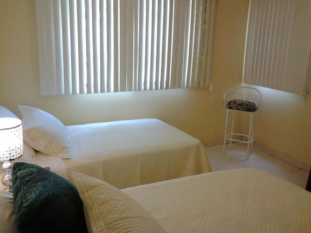 Voodi või voodid majutusasutuse Suites La Rosa toas