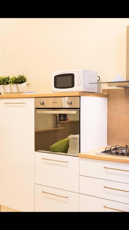 A kitchen or kitchenette at civico118 short lets