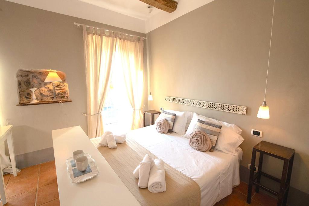 Postel nebo postele na pokoji v ubytování Hotel Borgo Vistalago