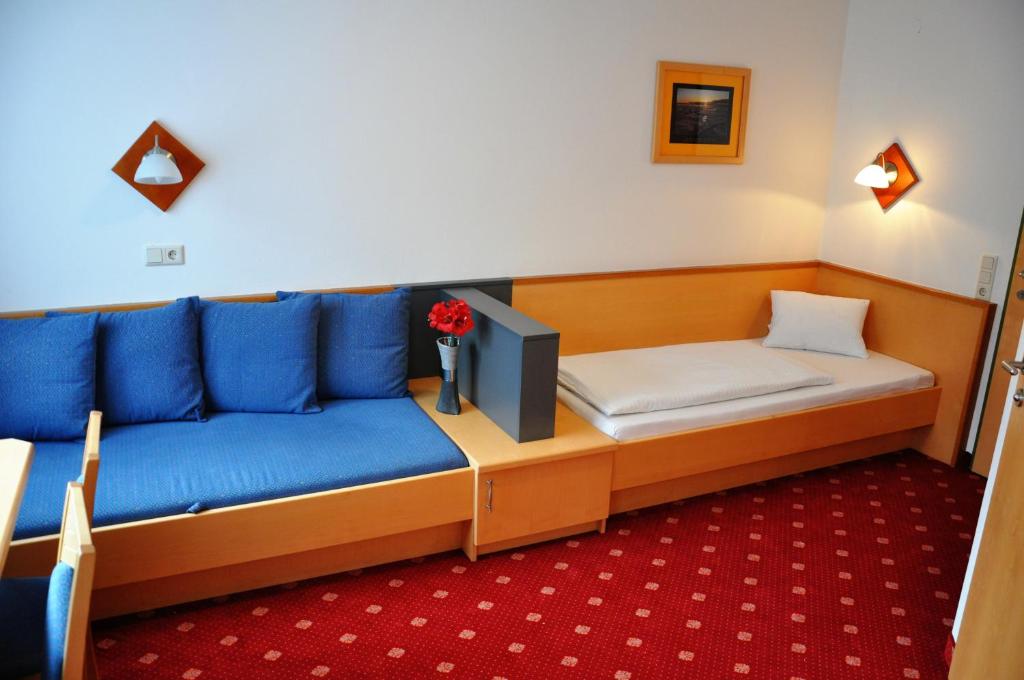 Postel nebo postele na pokoji v ubytování Pension Posauner
