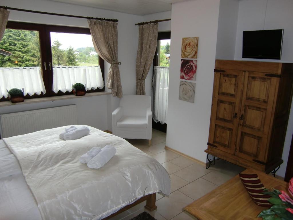 Postel nebo postele na pokoji v ubytování Hotel Garni Zeranka
