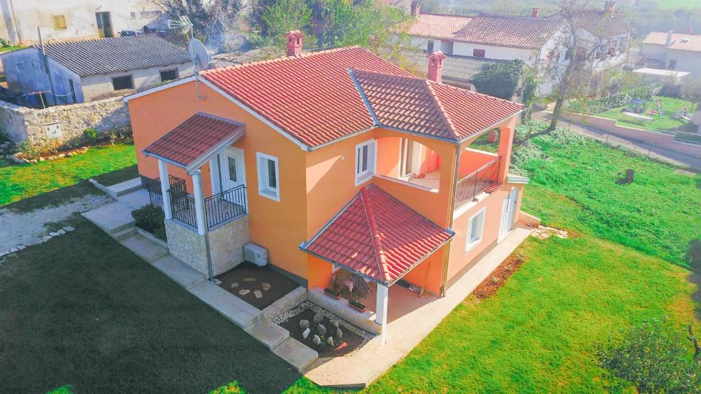 an overhead view of a house with a red roof at House Anna in Poreč