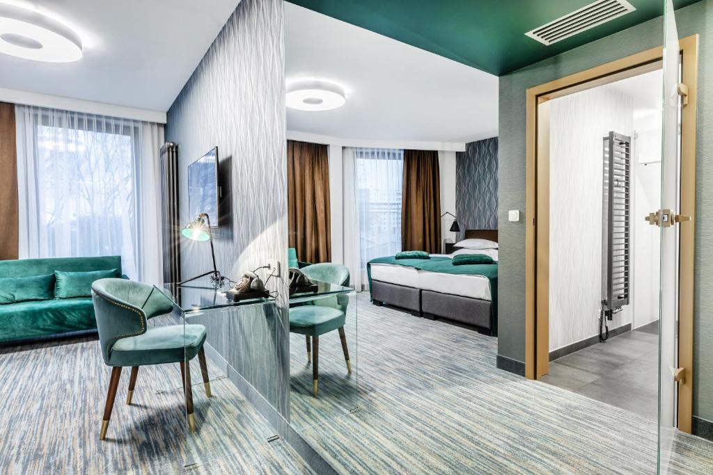 Posteľ alebo postele v izbe v ubytovaní Hotel Traugutta3