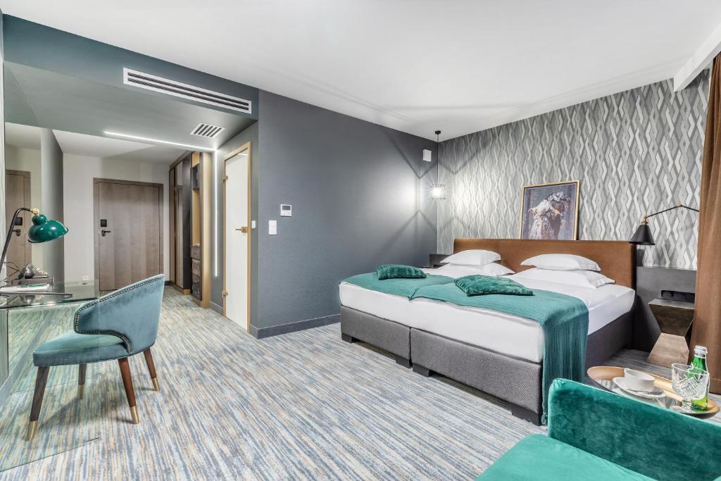 Posteľ alebo postele v izbe v ubytovaní Hotel Traugutta3