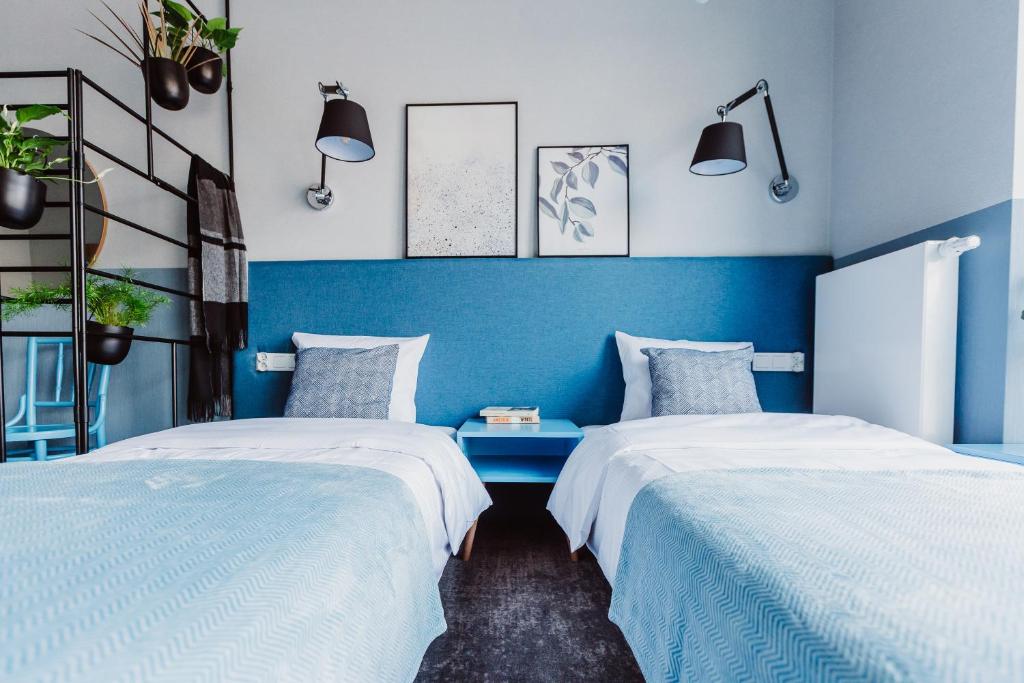 Posteľ alebo postele v izbe v ubytovaní Mosquito Silesia Apartments