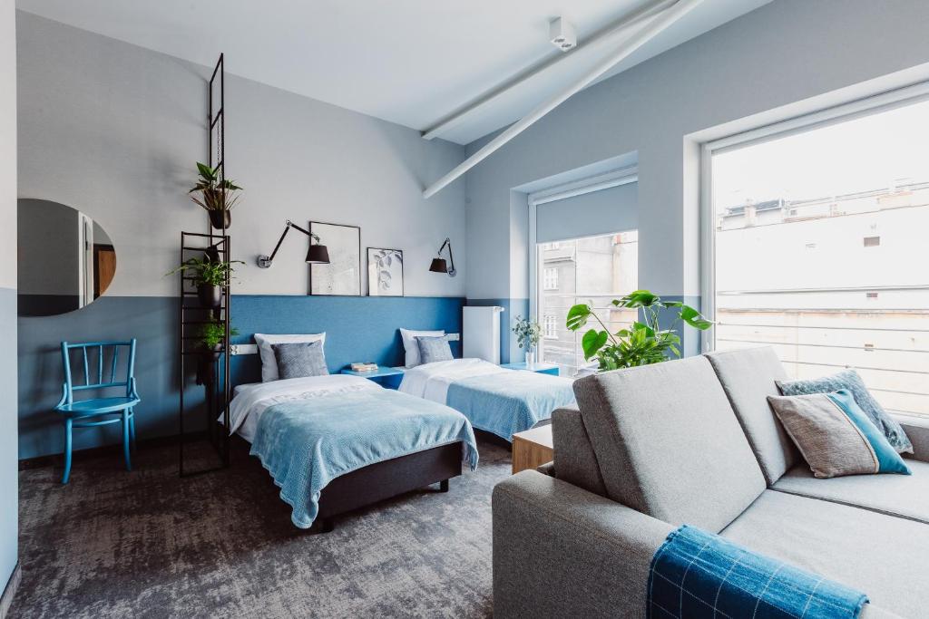 Posteľ alebo postele v izbe v ubytovaní Mosquito Silesia Apartments