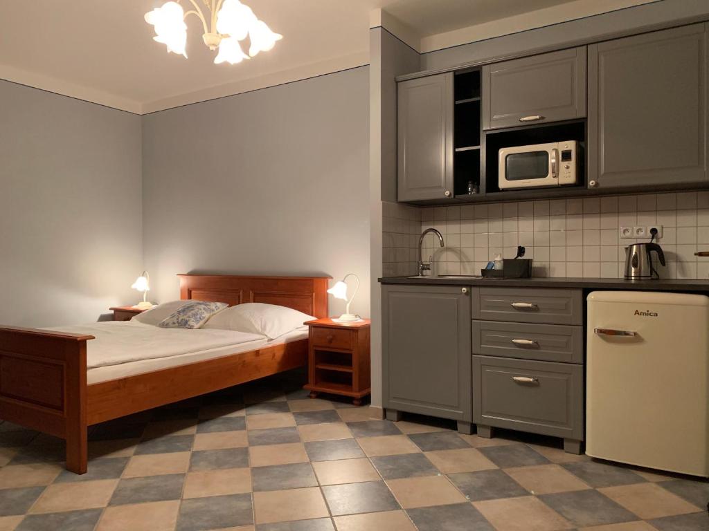 Kuchyň nebo kuchyňský kout v ubytování Pension Amadeus & Apartments