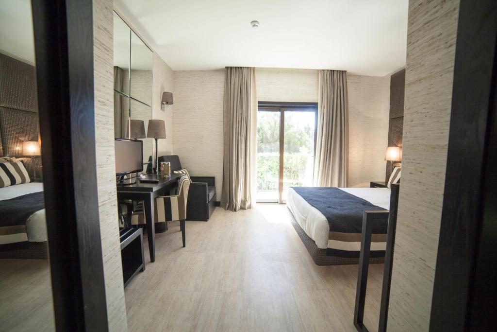 Uma cama ou camas num quarto em Alambique - Hotel Resort & Spa