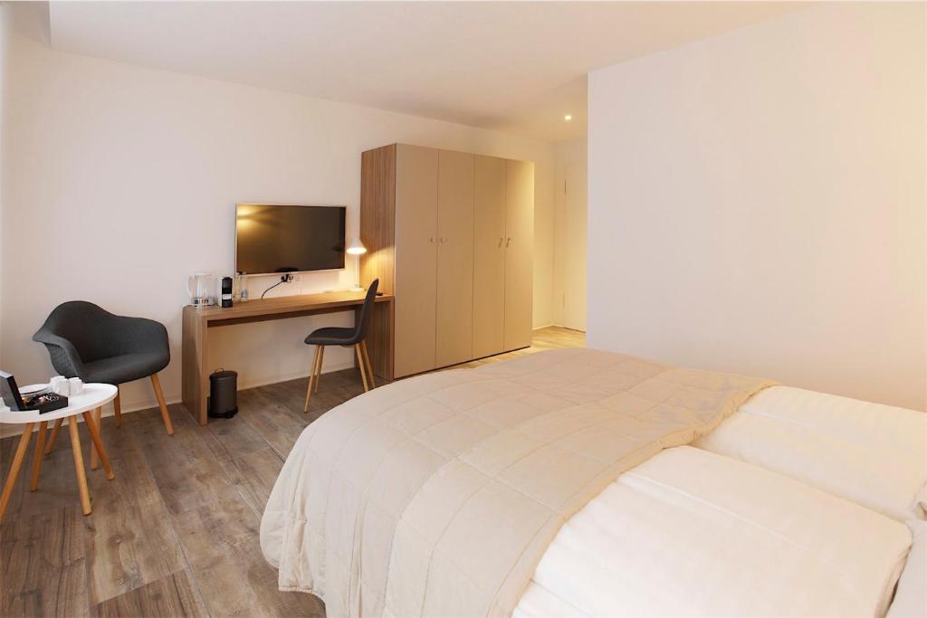 Postel nebo postele na pokoji v ubytování Hotel Work Life Residence am Bahnhof