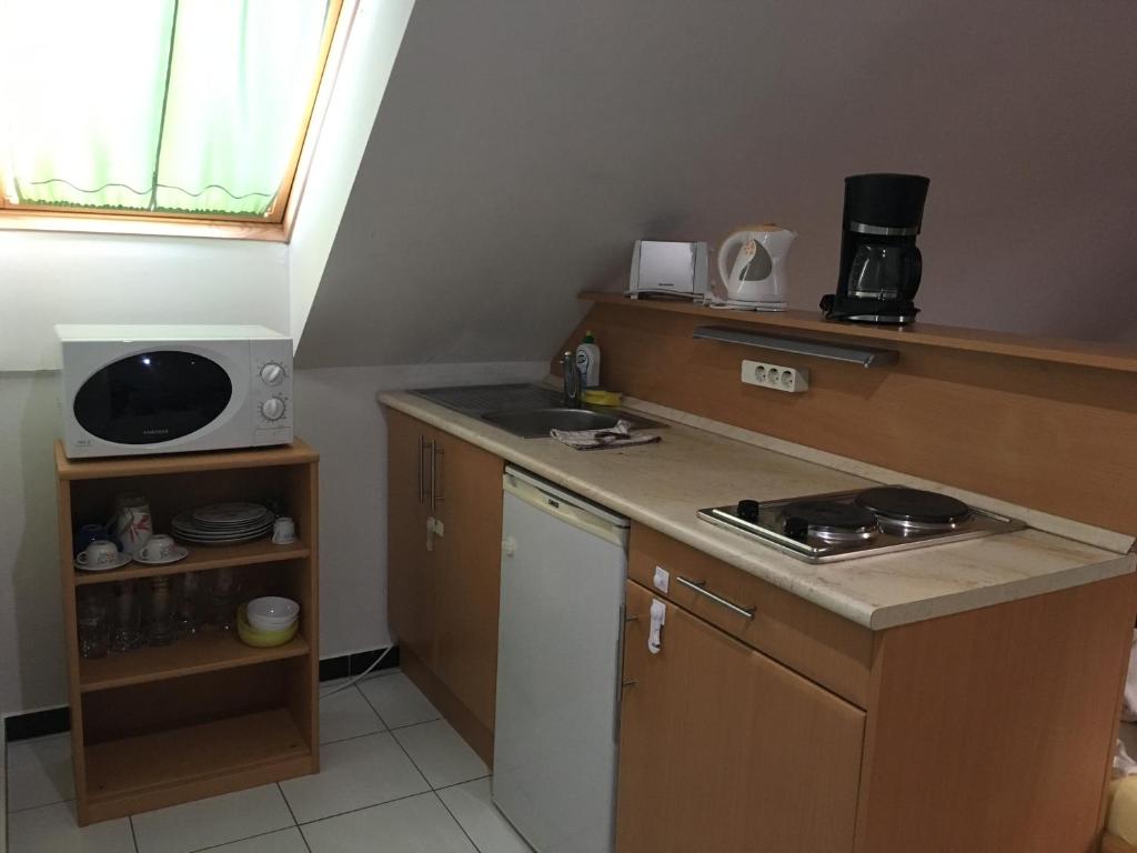 Kuchyňa alebo kuchynka v ubytovaní Mary Apartmanház Hévíz