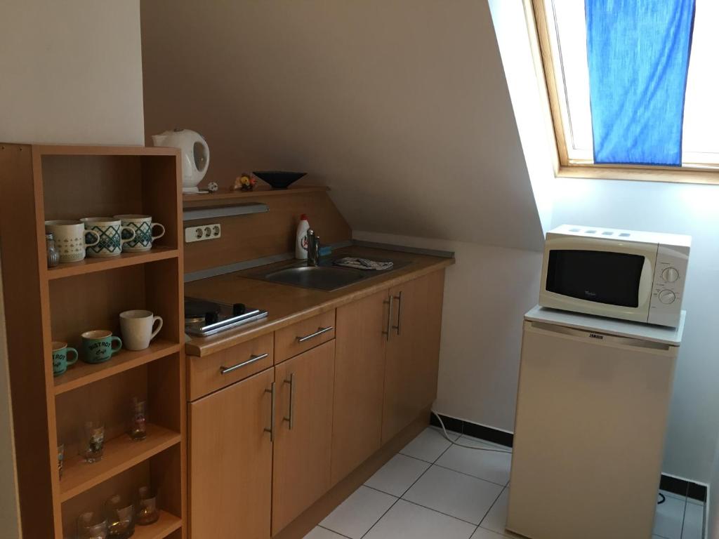 Kuchyňa alebo kuchynka v ubytovaní Mary Apartmanház Hévíz