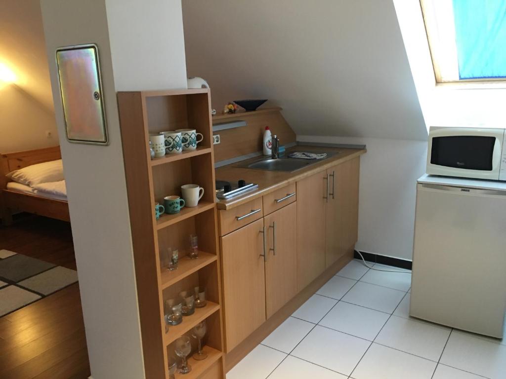 Kuchyňa alebo kuchynka v ubytovaní Mary Apartmanház Hévíz
