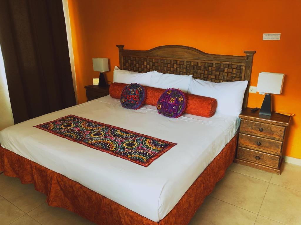Postel nebo postele na pokoji v ubytování Hotel Real Colonial