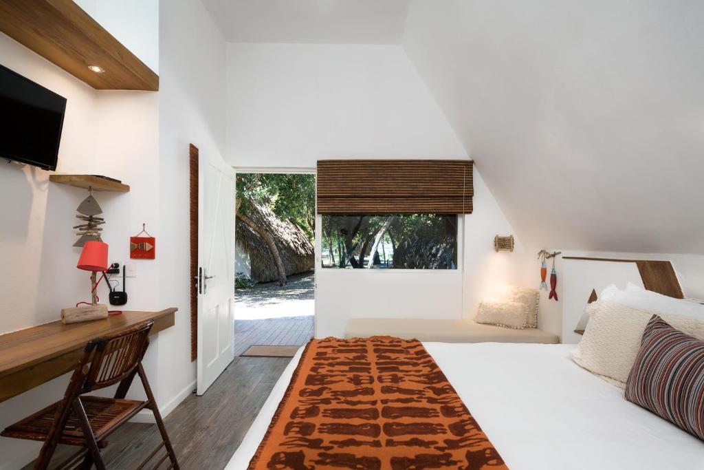 Postel nebo postele na pokoji v ubytování Punta Rucia Lodge Hotel Boutique & Spa