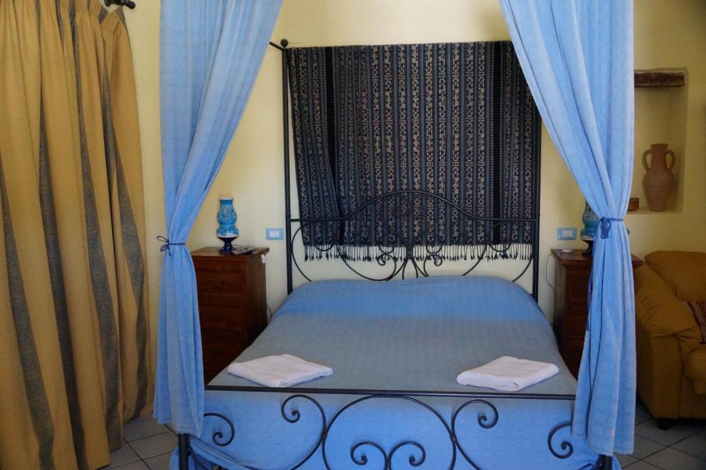 Postel nebo postele na pokoji v ubytování Casa Matarazzo