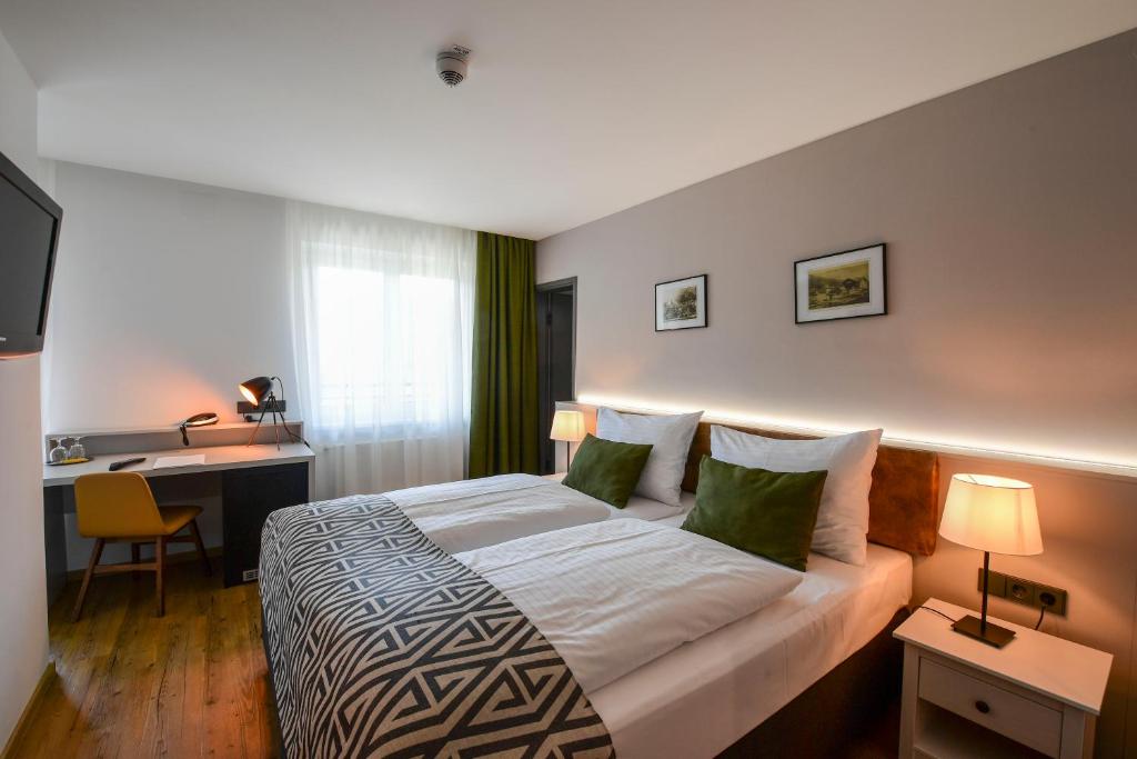 Postel nebo postele na pokoji v ubytování Hotel Alpenblick Kreischberg