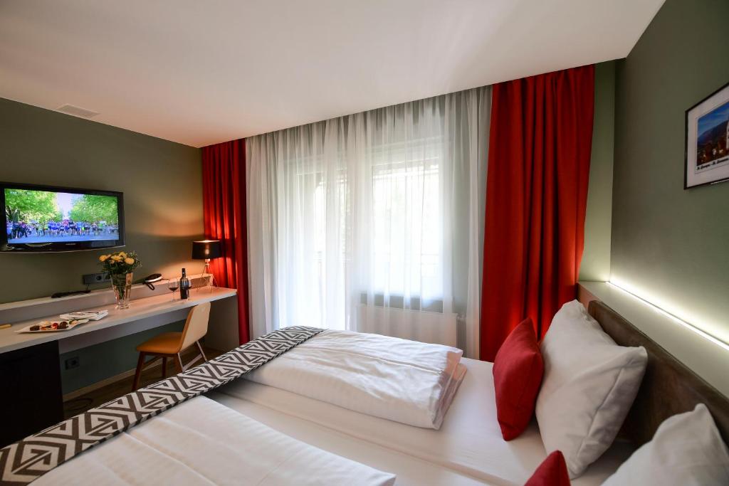Postel nebo postele na pokoji v ubytování Hotel Alpenblick Kreischberg