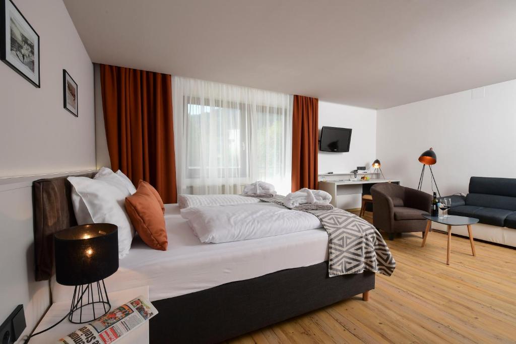 Postel nebo postele na pokoji v ubytování Hotel Alpenblick Kreischberg