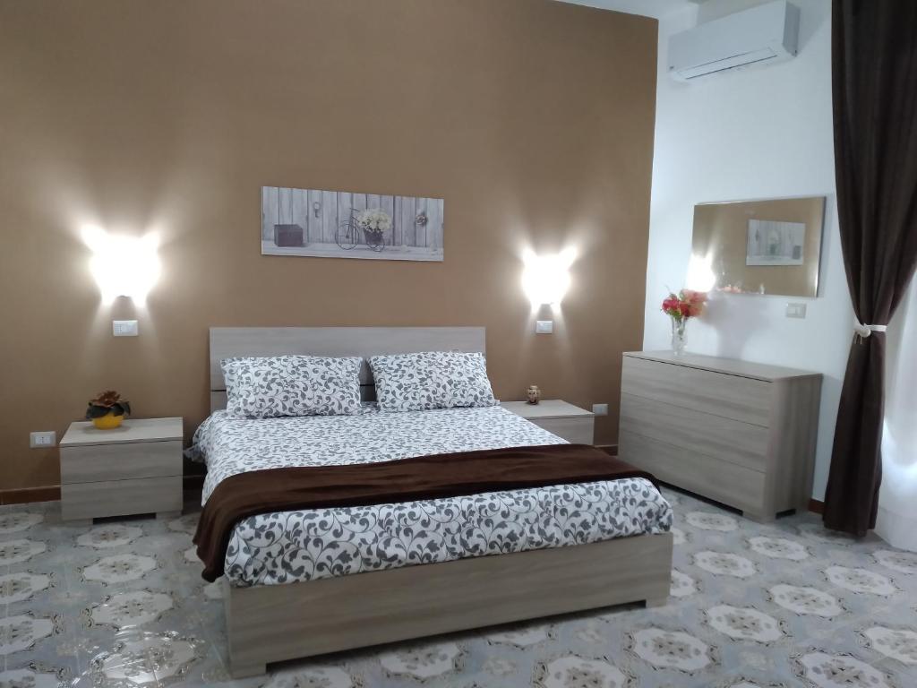 Ένα ή περισσότερα κρεβάτια σε δωμάτιο στο Una Scala Dal Centro