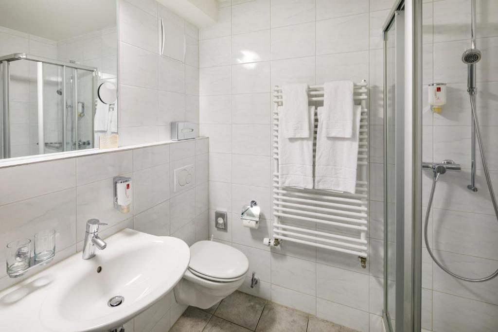 Koupelna v ubytování Central Hotel Post