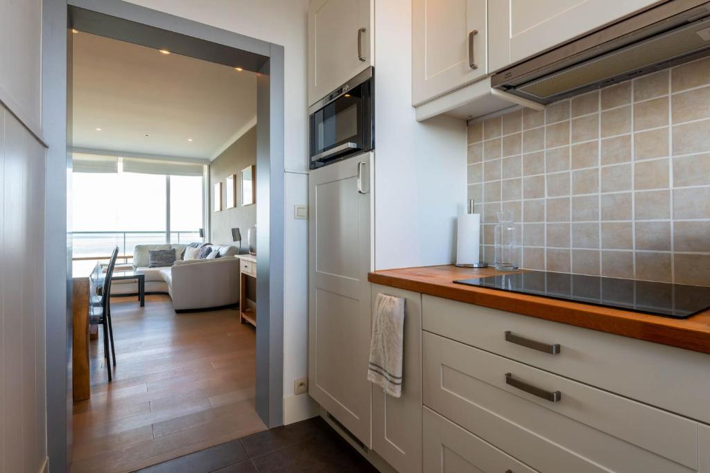 Kuchyň nebo kuchyňský kout v ubytování Panoramic & Modern apartment with sea view