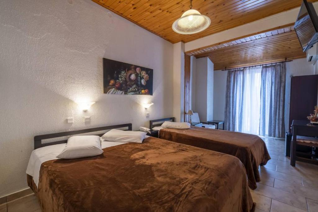מיטה או מיטות בחדר ב-Hotel Lefas