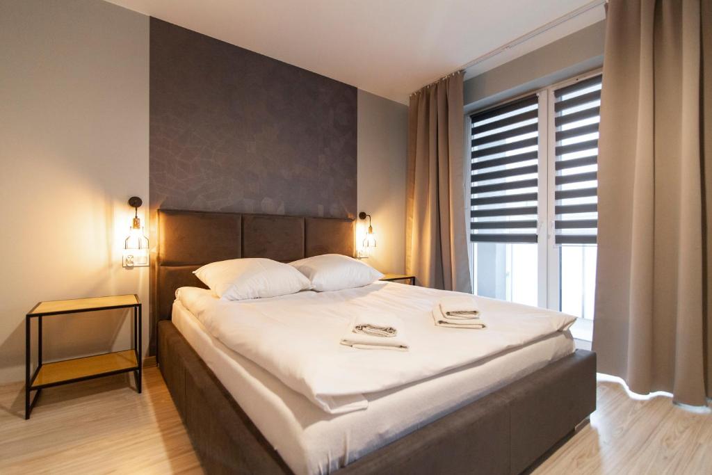 Posteľ alebo postele v izbe v ubytovaní Apartamenty Białystok - Botaniczna 9A/21